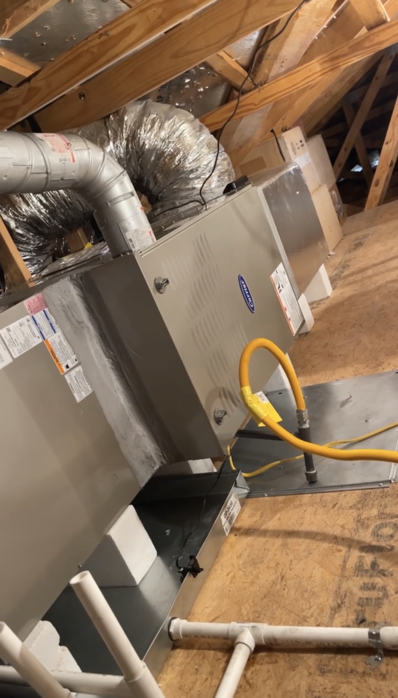 Carrier HVAC system installed in an attic with connected ductwork