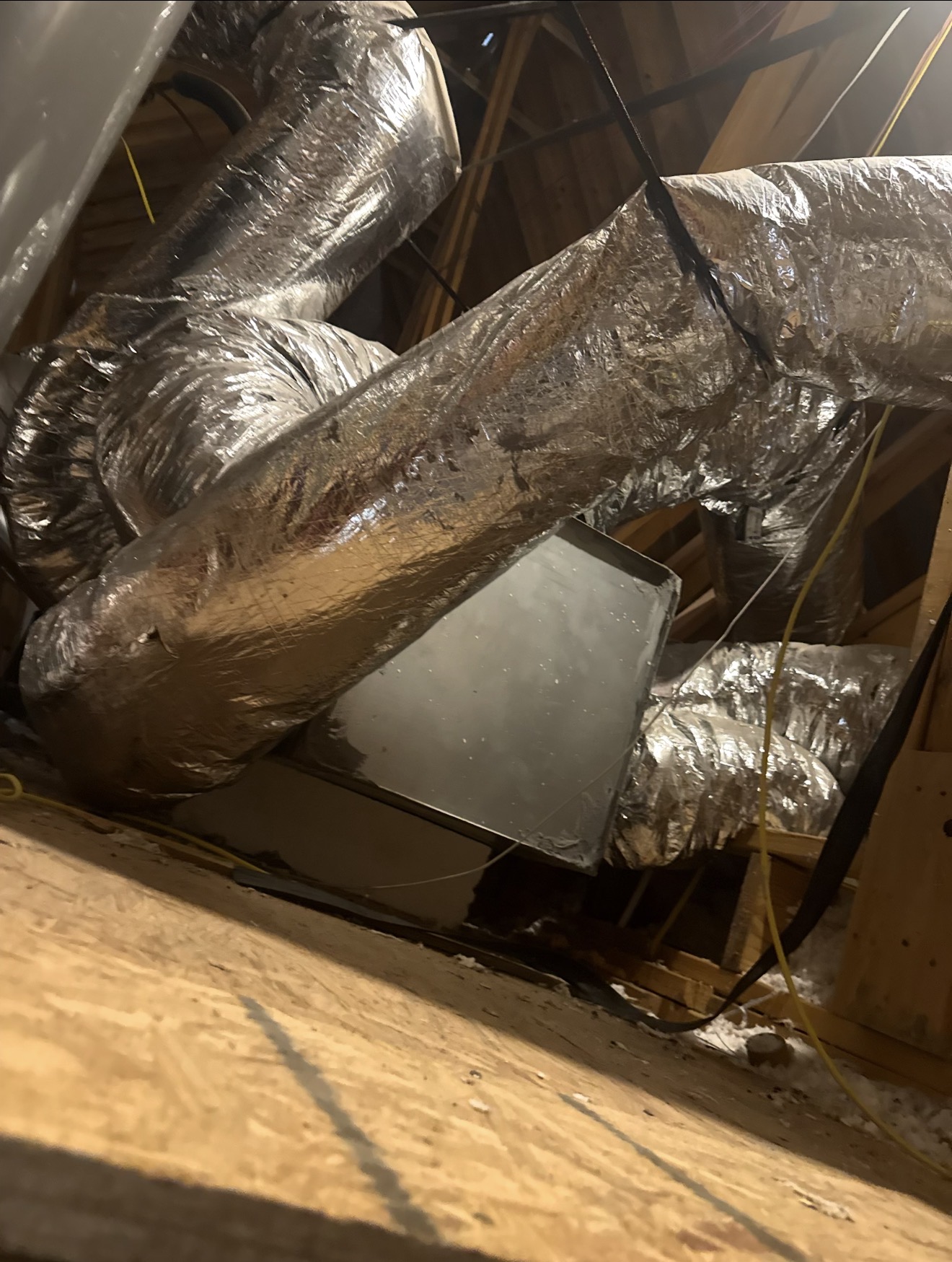 Before — poorly sealed metal supply plenum