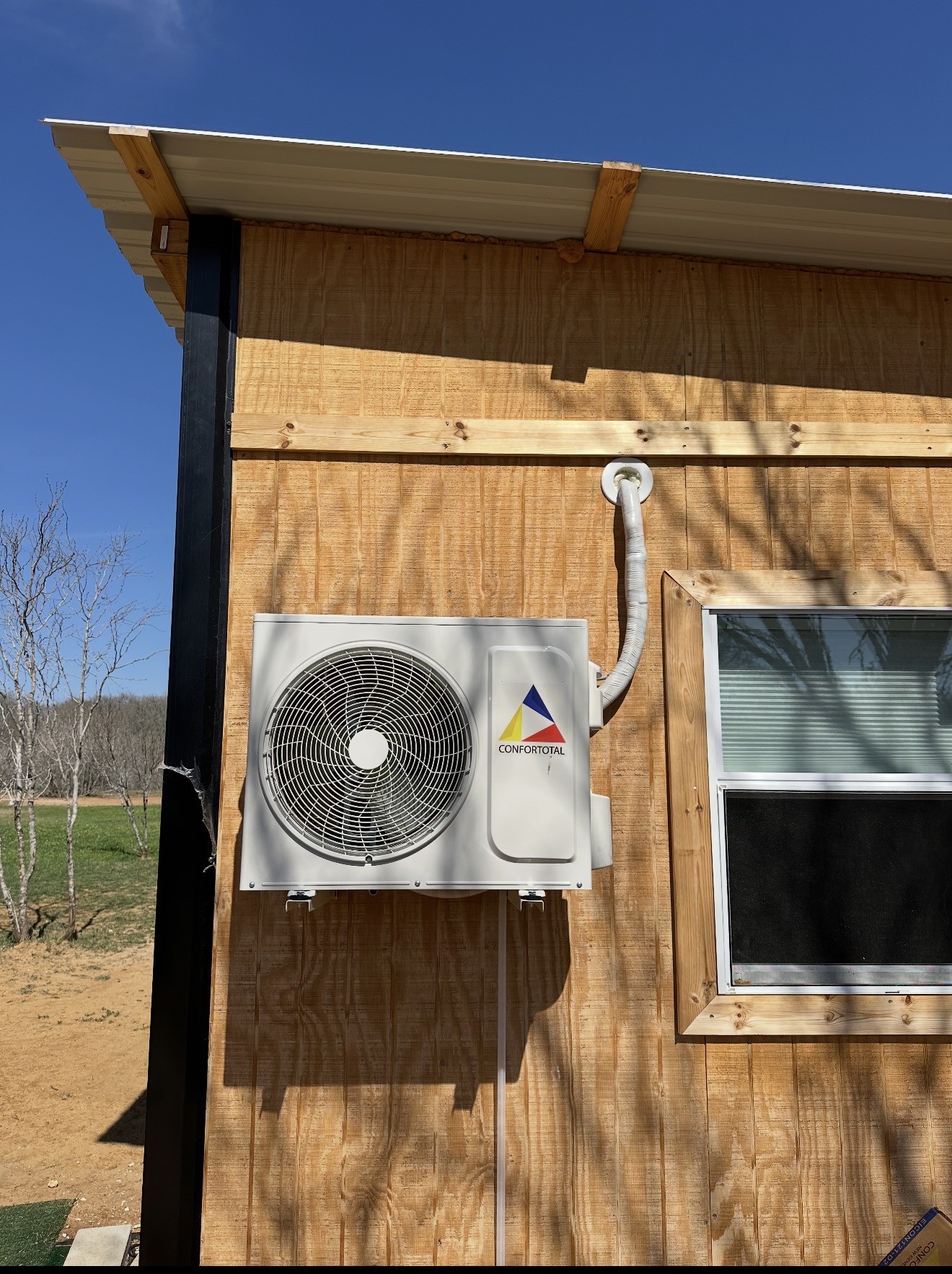 Wall-mounted outdoor ductless mini-split unit
